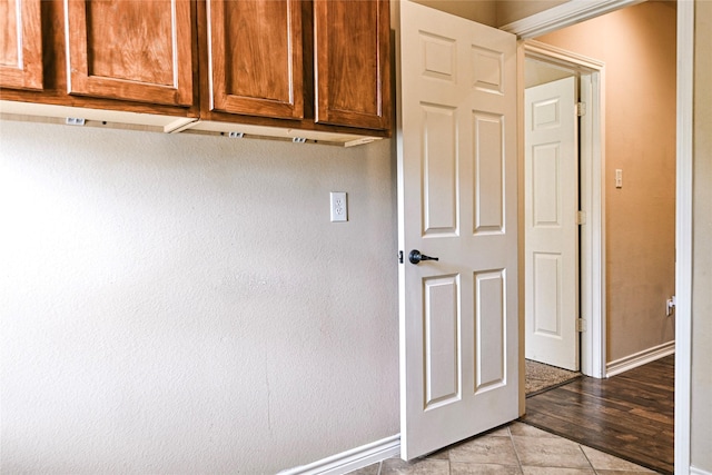 104 Coldwater Creek Ln, Weatherford, TX 76088 - laundry room featuring baseboards and light tile patterned flooring