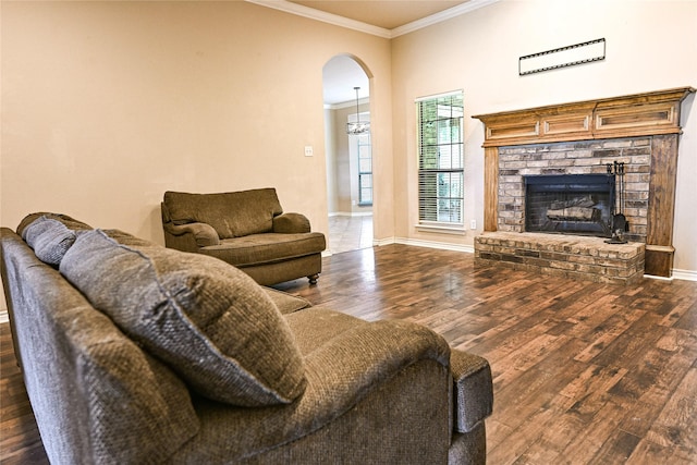 104 Coldwater Creek Ln, Weatherford, TX 76088 - living area with ornamental molding, wood finished floors, arched walkways, and a brick fireplace