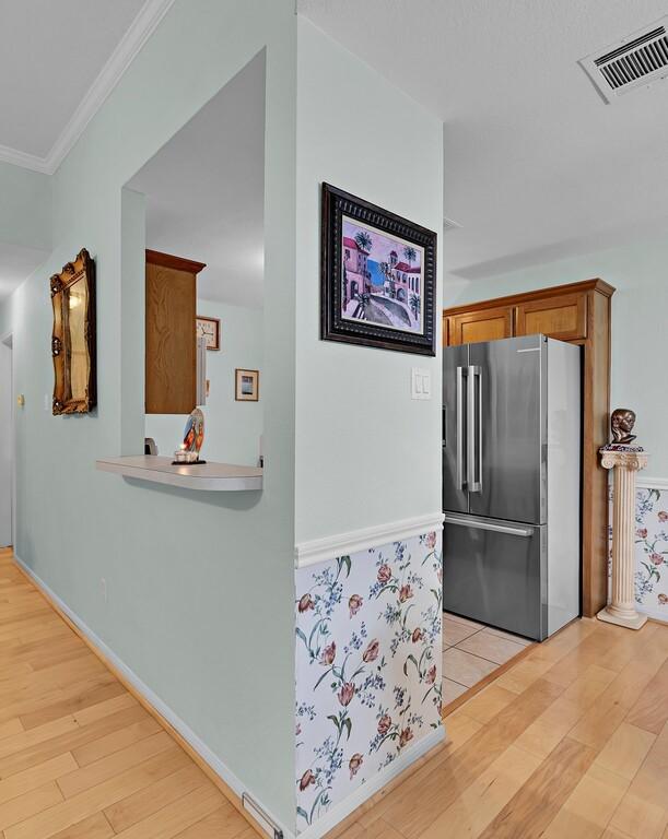308 Greystone Dr, Lorena, TX 76655 - hallway featuring light wood-style floors and ornamental molding