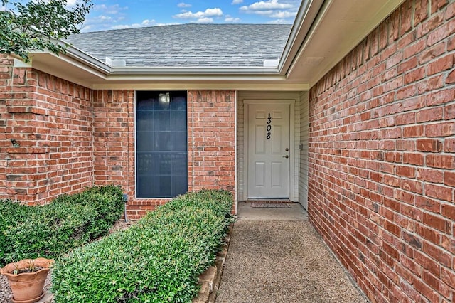 308 Greystone Dr, Lorena, TX 76655 - doorway to property featuring brick siding and a shingled roof