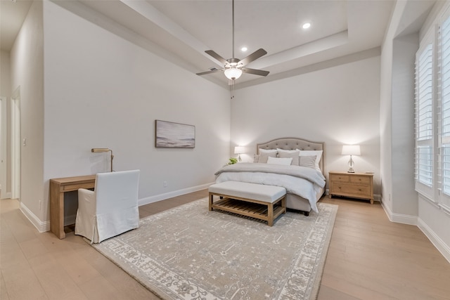 2232 Offerande Dr, Fort Worth, TX 76008 - bedroom featuring light wood-type flooring, multiple windows, a raised ceiling, recessed lighting, and ceiling fan