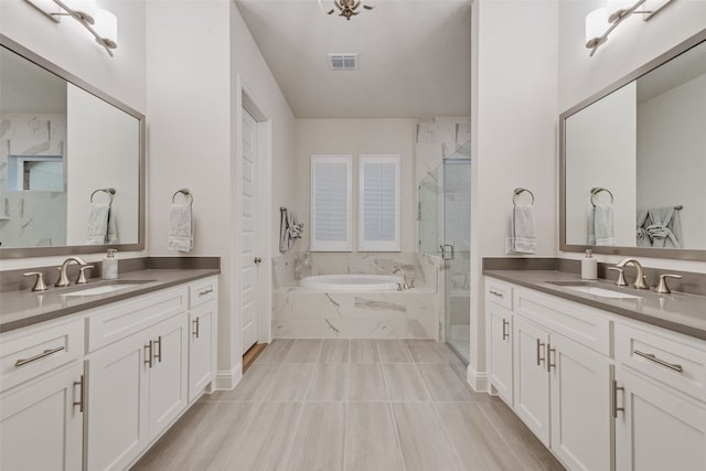 2232 Offerande Dr, Fort Worth, TX 76008 - bathroom featuring two vanities, a garden tub, and a marble finish shower