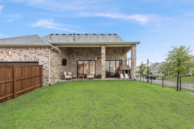 2232 Offerande Dr, Fort Worth, TX 76008 - rear view of house with a patio, brick siding, an outdoor living space, a fenced backyard, and a shingled roof