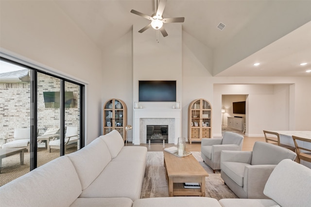 2232 Offerande Dr, Fort Worth, TX 76008 - living area featuring high vaulted ceiling, ceiling fan, a high end fireplace, recessed lighting, and light wood finished floors