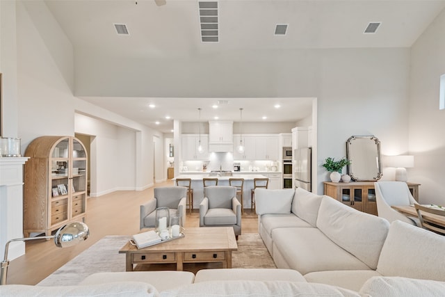 2232 Offerande Dr, Fort Worth, TX 76008 - living area featuring light wood-style flooring and recessed lighting