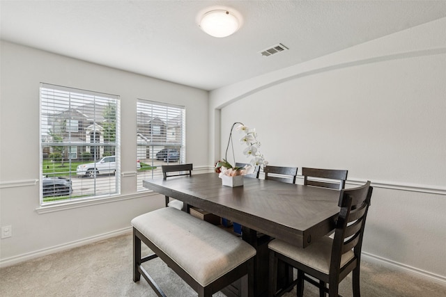 2708 Ferdinand, Grand Prairie, TX 75054 - dining room with baseboards and light carpet