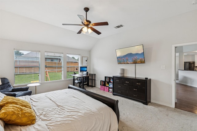 2708 Ferdinand, Grand Prairie, TX 75054 - carpeted bedroom with freestanding refrigerator, vaulted ceiling, and a ceiling fan