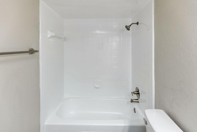 520 Hawthorne Dr, Allen, TX 75002 - bathroom with a textured wall and shower / washtub combination