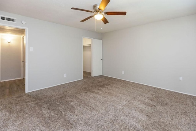 520 Hawthorne Dr, Allen, TX 75002 - unfurnished bedroom featuring carpet, a walk in closet, a ceiling fan, and a closet