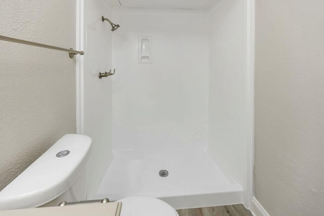 520 Hawthorne Dr, Allen, TX 75002 - full bathroom with a walk in shower, wood finished floors, and a textured wall
