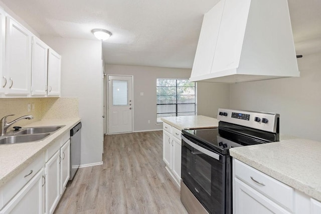 520 Hawthorne Dr, Allen, TX 75002 - kitchen with stainless steel appliances, custom exhaust hood, light wood finished floors, light countertops, and white cabinets