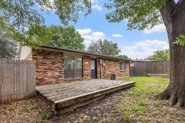 520 Hawthorne Dr, Allen, TX 75002 - rear view of property featuring a fenced backyard, a wooden deck, and brick siding