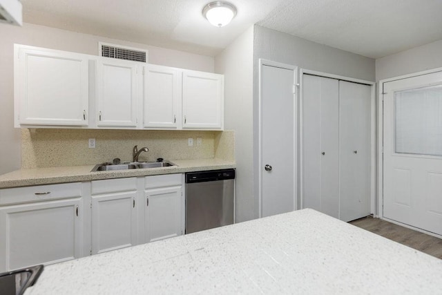 520 Hawthorne Dr, Allen, TX 75002 - kitchen featuring dishwasher, light countertops, white cabinets, and wood finished floors