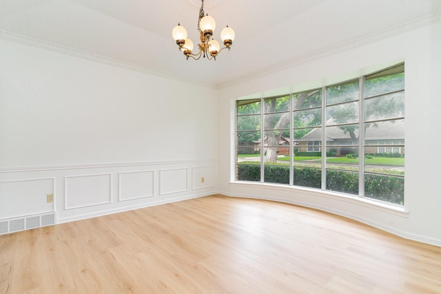 3004 Glasgow Dr, Arlington, TX 76015 - empty room featuring a chandelier, wood finished floors, wainscoting, and crown molding
