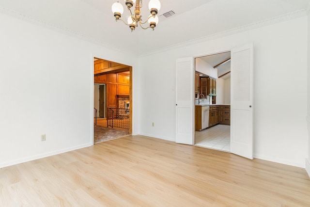 3004 Glasgow Dr, Arlington, TX 76015 - empty room featuring a chandelier, light wood-style flooring, and crown molding