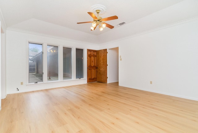 3004 Glasgow Dr, Arlington, TX 76015 - unfurnished room featuring ceiling fan, light wood-style flooring, ornamental molding, and a raised ceiling