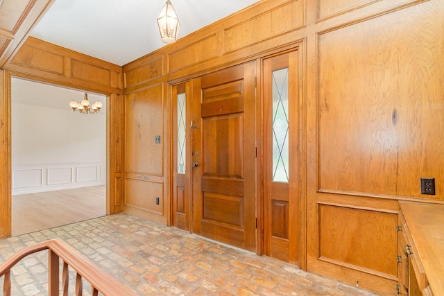 3004 Glasgow Dr, Arlington, TX 76015 - foyer entrance featuring a decorative wall, brick patterned flooring, and a chandelier