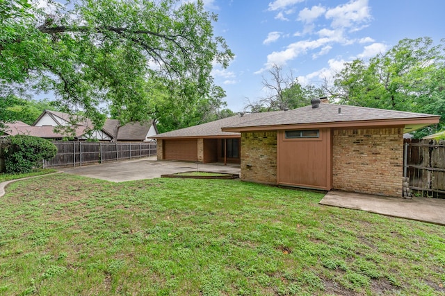 3004 Glasgow Dr, Arlington, TX 76015 - rear view of property with a patio, brick siding, a garage, driveway, and roof with shingles
