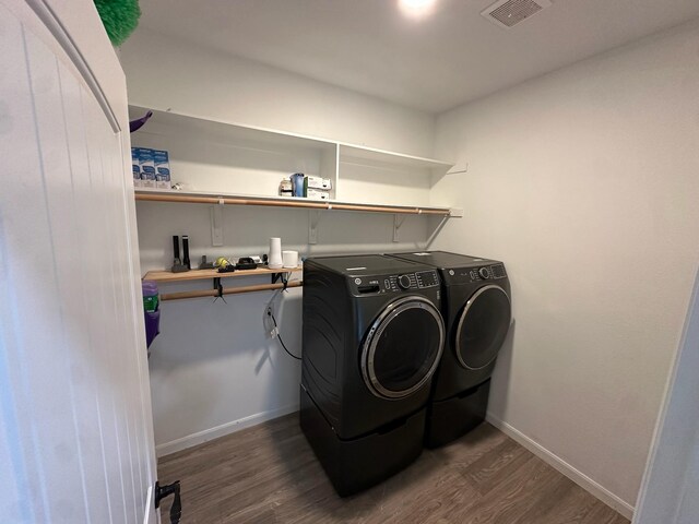 2352 Wynchase Ln, Crandall, TX 75114 - washroom featuring washer and clothes dryer and dark wood-type flooring