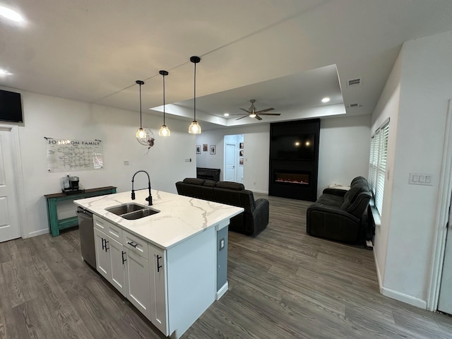 2352 Wynchase Ln, Crandall, TX 75114 - kitchen with a raised ceiling, dark wood-type flooring, a ceiling fan, dishwasher, and open floor plan