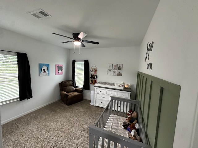 2352 Wynchase Ln, Crandall, TX 75114 - bedroom with a nursery area, dark carpet, and ceiling fan