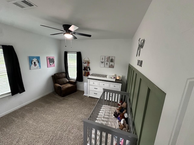2352 Wynchase Ln, Crandall, TX 75114 - bedroom with a crib, dark carpet, and a ceiling fan