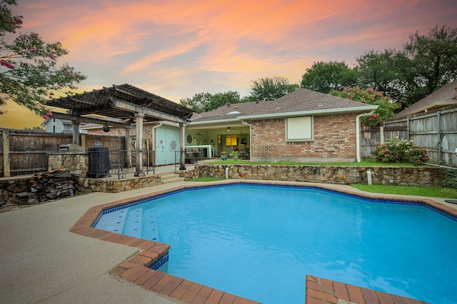 3121 Oakdale Dr, Hurst, TX 76054 - pool at dusk with a patio area, a pergola, a fenced backyard, and area for grilling
