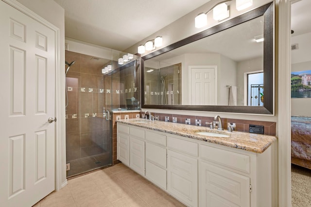 3121 Oakdale Dr, Hurst, TX 76054 - bathroom featuring double vanity, a shower stall, and tile patterned flooring