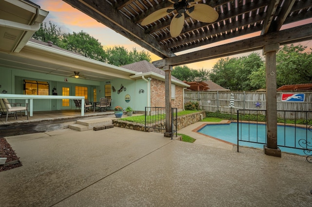 3121 Oakdale Dr, Hurst, TX 76054 - pool at dusk with ceiling fan and a patio