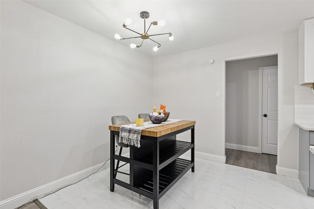 348 Thompson St, Fort Worth, TX 76134 - dining space featuring light marble finish floors and a chandelier