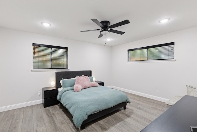 348 Thompson St, Fort Worth, TX 76134 - bedroom with multiple windows, wood finished floors, a ceiling fan, and recessed lighting