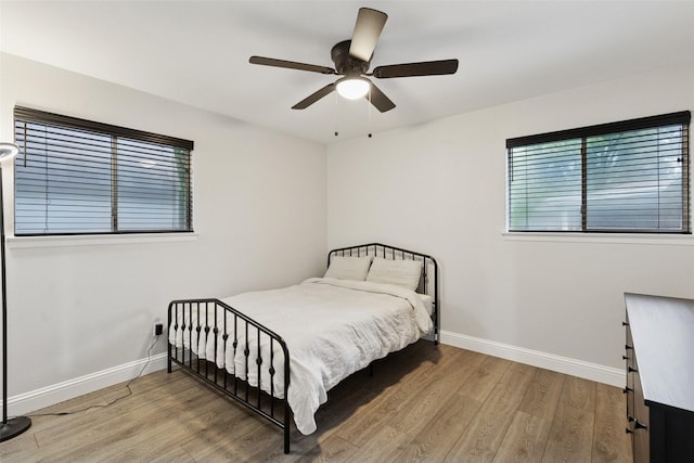 348 Thompson St, Fort Worth, TX 76134 - bedroom featuring wood finished floors and ceiling fan