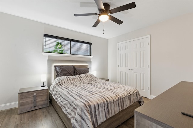 348 Thompson St, Fort Worth, TX 76134 - bedroom with wood finished floors, a closet, and ceiling fan