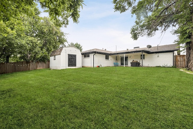 348 Thompson St, Fort Worth, TX 76134 - back of house with a fenced backyard, a shed, and brick siding