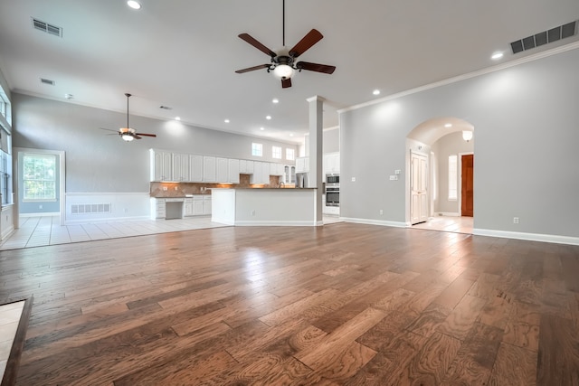 305 Wood Duck Ln, Mckinney, TX 75072 - unfurnished living room with a ceiling fan, ornamental molding, hardwood / wood-style flooring, recessed lighting, and plenty of natural light
