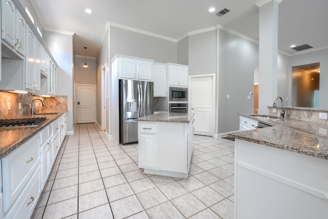 305 Wood Duck Ln, Mckinney, TX 75072 - kitchen featuring stainless steel appliances, light tile patterned floors, a kitchen island, backsplash, and stone countertops