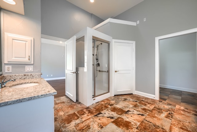 305 Wood Duck Ln, Mckinney, TX 75072 - full bathroom featuring stone finish flooring, a shower stall, vanity, and high vaulted ceiling