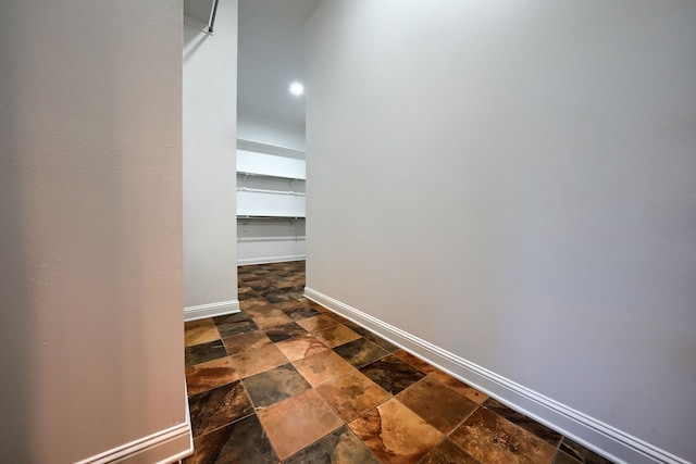 305 Wood Duck Ln, Mckinney, TX 75072 - corridor with dark stone finish floors and recessed lighting