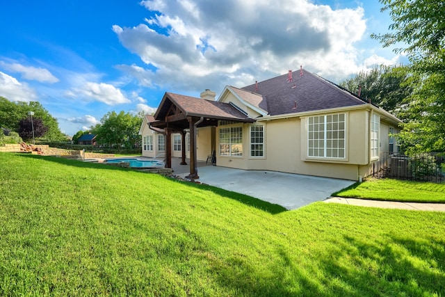 305 Wood Duck Ln, Mckinney, TX 75072 - rear view of house with a patio area, stucco siding, roof with shingles, and a chimney