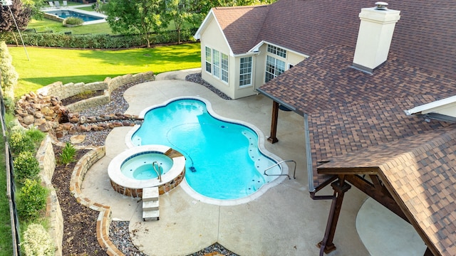 305 Wood Duck Ln, Mckinney, TX 75072 - view of pool with a patio, a yard, and a pool with connected hot tub