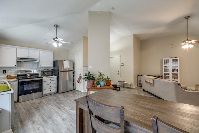 212 Valley Spring Dr, Arlington, TX 76018 - kitchen with stainless steel appliances, ceiling fan, lofted ceiling, under cabinet range hood, and white cabinetry