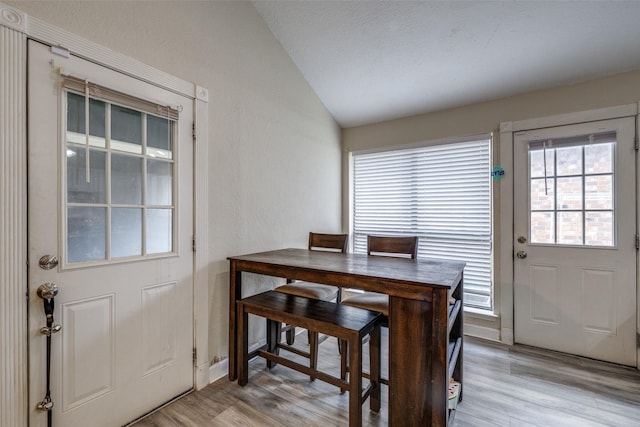 212 Valley Spring Dr, Arlington, TX 76018 - dining space with lofted ceiling and light wood-style flooring
