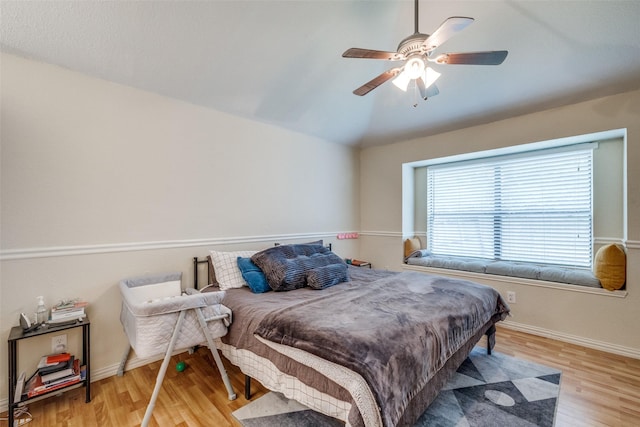 212 Valley Spring Dr, Arlington, TX 76018 - bedroom with lofted ceiling, wood finished floors, and a ceiling fan
