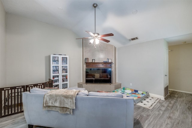 212 Valley Spring Dr, Arlington, TX 76018 - living area featuring vaulted ceiling, light wood-type flooring, and a ceiling fan