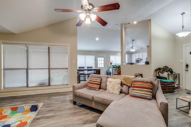 212 Valley Spring Dr, Arlington, TX 76018 - living area with lofted ceiling, a ceiling fan, and light wood finished floors