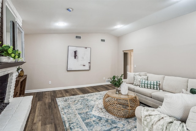 8688 Grenadier Ct, Dallas, TX 75238 - living area with a fireplace, lofted ceiling, and dark wood-style flooring