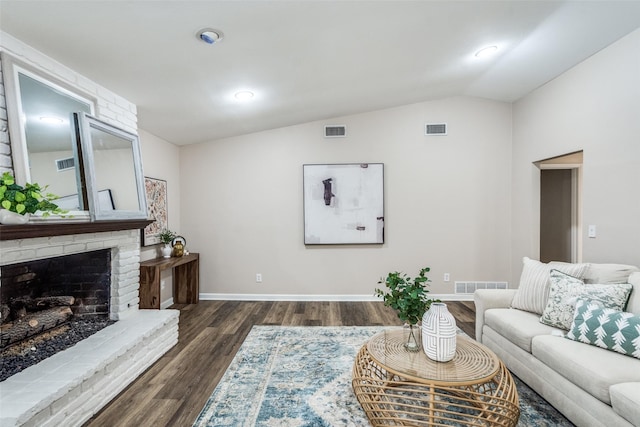 8688 Grenadier Ct, Dallas, TX 75238 - living area with vaulted ceiling, dark wood-style floors, a brick fireplace, and recessed lighting