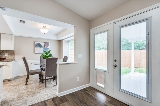 8688 Grenadier Ct, Dallas, TX 75238 - dining space with dark wood-type flooring and a tray ceiling