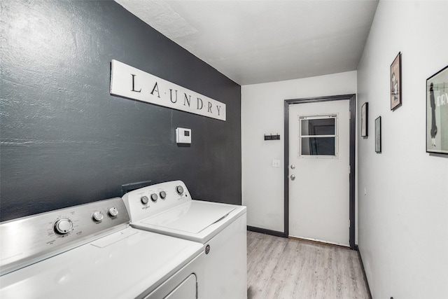 8688 Grenadier Ct, Dallas, TX 75238 - washroom with washing machine and dryer and light wood-style floors