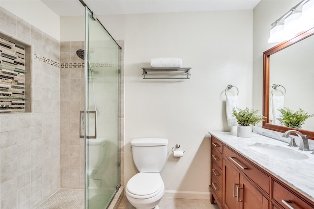 8688 Grenadier Ct, Dallas, TX 75238 - bathroom featuring vanity, a shower stall, and tile patterned floors